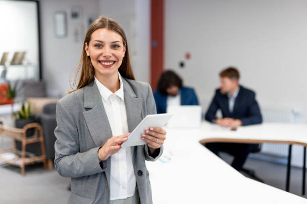 istock Smiling businesswoman posing in modern office 2163466014