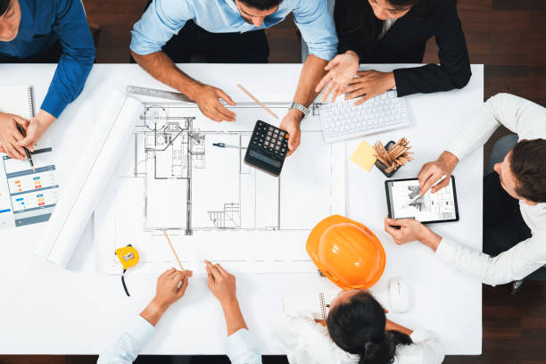 istock Diverse group of civil engineer and client working on architect. Prudent 2163467137