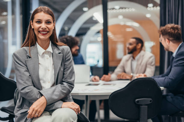 istock Smiling businesswoman posing in modern office 2163468160