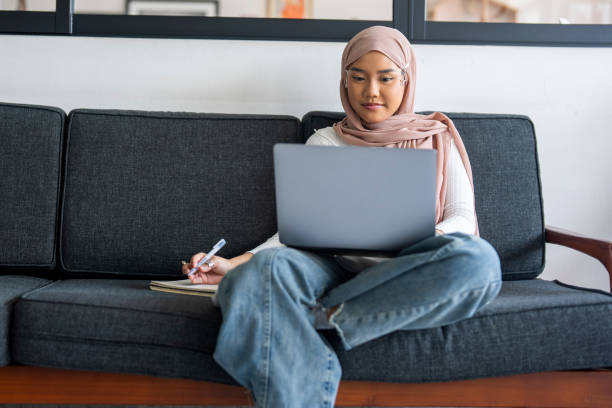istock Young Malay Woman working from home 2163468475