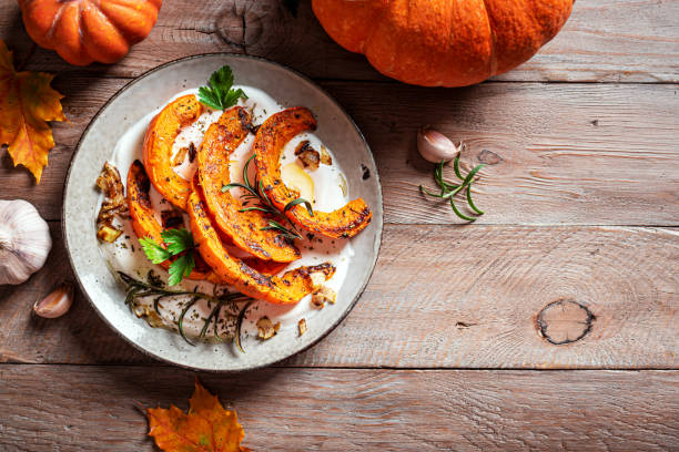 istock Roasted pumpkin with greek yogurt and herbs 2163471376