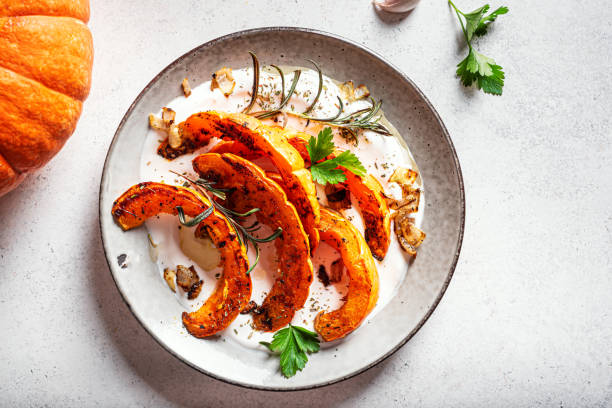 istock Roasted pumpkin with greek yogurt and herbs 2163471380