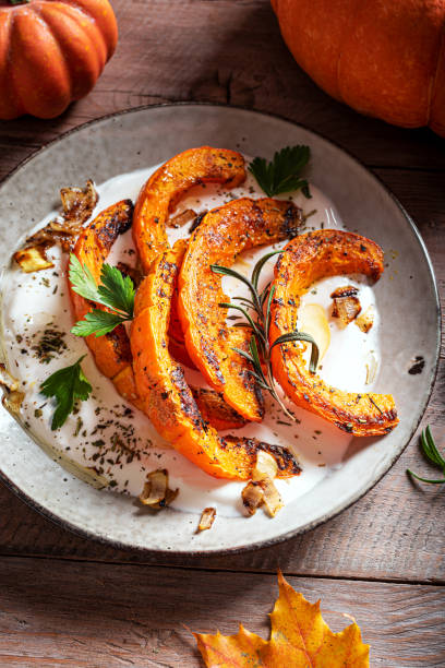 istock Roasted pumpkin with greek yogurt and herbs 2163471420