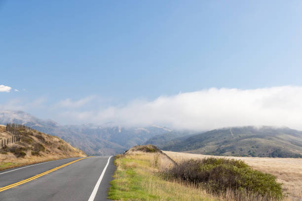 Asphalt road and countryside landscape of Highway 1 in United States