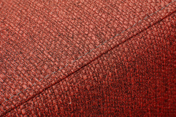 istock Textured red furniture fabric with stitching 2163473634