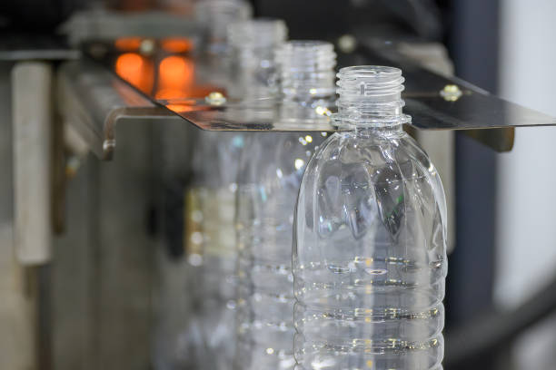 istock The drinking water bottle manufacturing process by blow mold machine. 2163474122