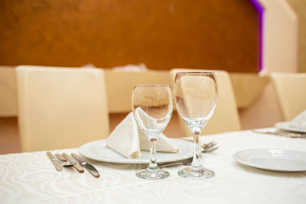 istock Two transparent glasses placed on a wedding table 2163475939