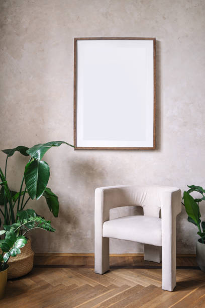 istock White chair and empty picture frame in modern interior 2163485072
