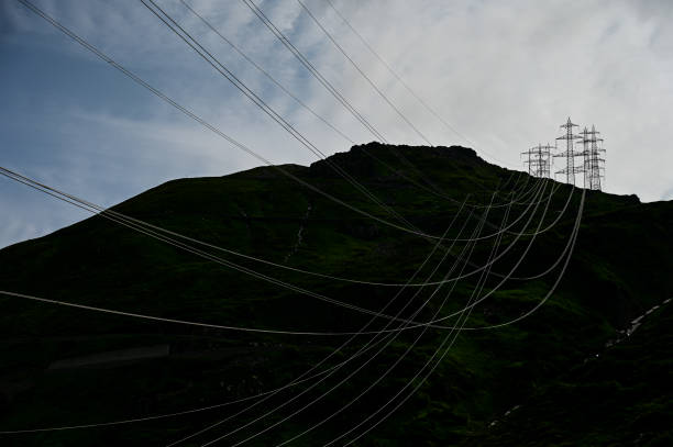 istock Electricty pylons and wires in the mountains 2163485256