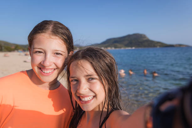 istock Happy girls taking a selfie 2163489074
