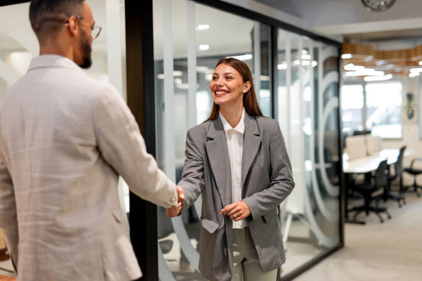 istock A smiling female employee handshake for Successful partnership 2163489301