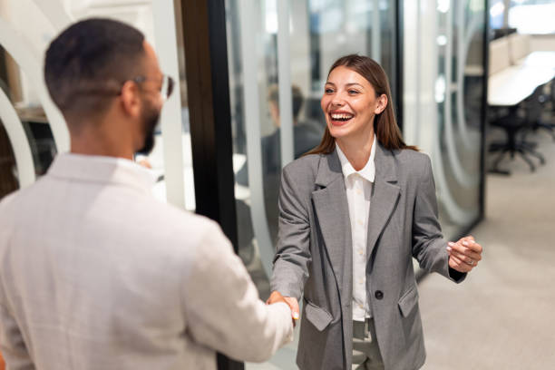 istock A smiling female employee handshake for Successful partnership 2163489852