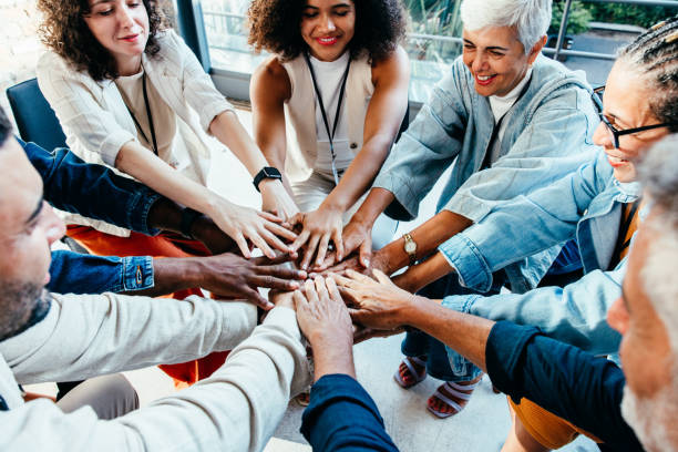 istock Team unity in the workplace with diverse business colleagues collaborating in the office 2163491484