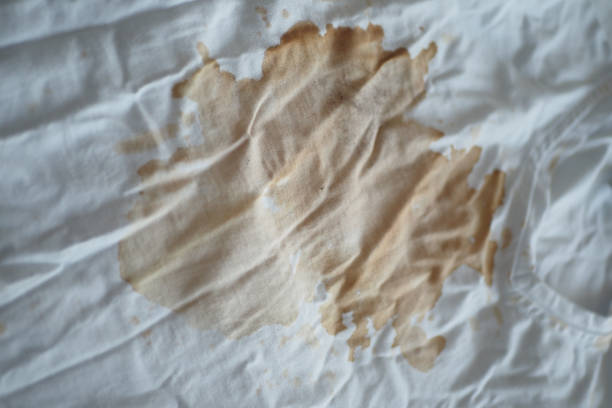 istock spilled coffee on a white shirt 2163493387