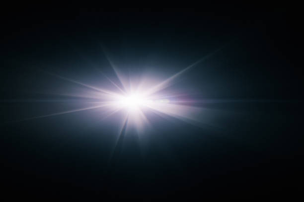 Lens flare on black background. Overlay design element