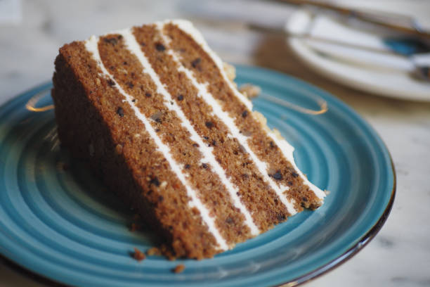 istock chocolate and cream cake on a plate on table 2163493681