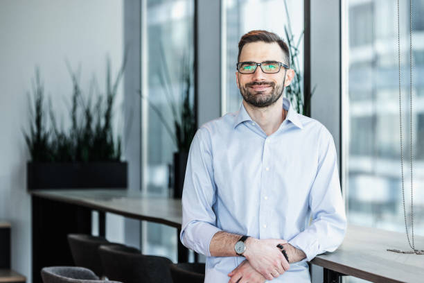 istock Portrait of an office worker standing in a modern office 2163493921