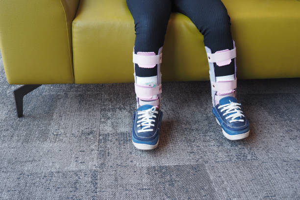 istock Child cerebral palsy disability, legs orthosis. 2163494072
