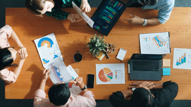 istock Top view of manager use tablet to analyze data and financial chart. Convocation. 2163494084