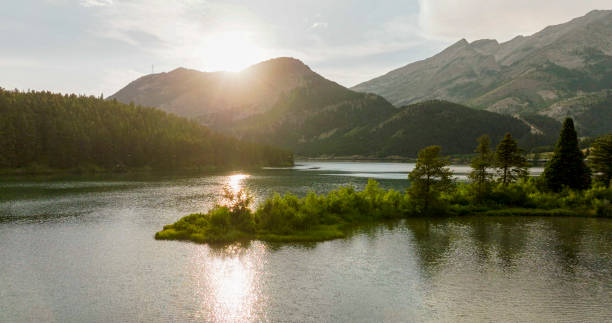 istock Sunset over lake and mountains 2163495249