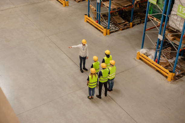 istock Warehouse Supervisor Dismissing Team Members 2163495447