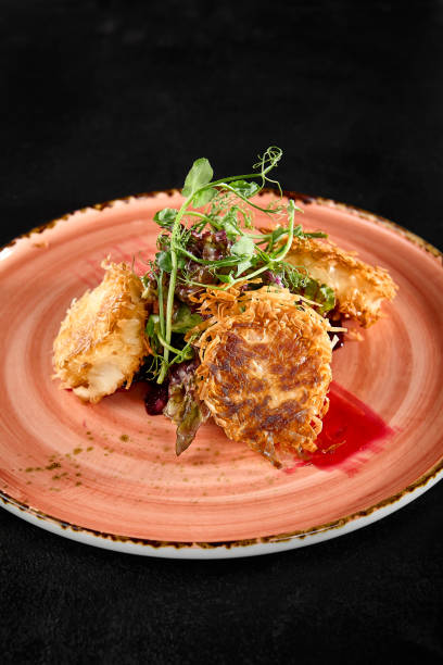 istock Delicious Tempura Fried Cheese with Beet Garnish on Artistic Plate 2163498949