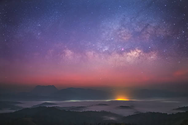 istock Starry Sky Over Misty Mountains at Dawn 2163499300