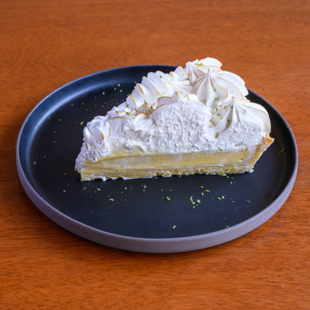 istock Lemon pie slice served on a plate with meringue and lemon zest 2163499369