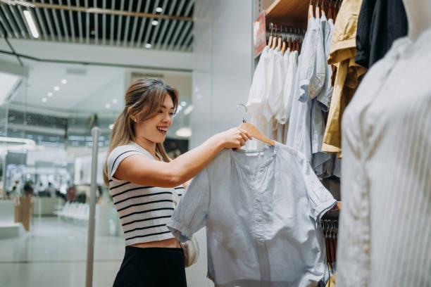 istock Trendy Treasures: A Young Woman's Shopping Spree 2163500066