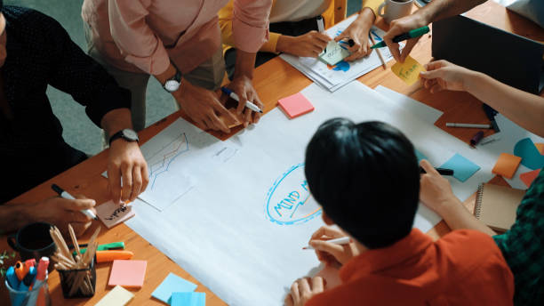 istock Top view of smart business team hand writing idea on sticky notes. Convocation. 2163500222