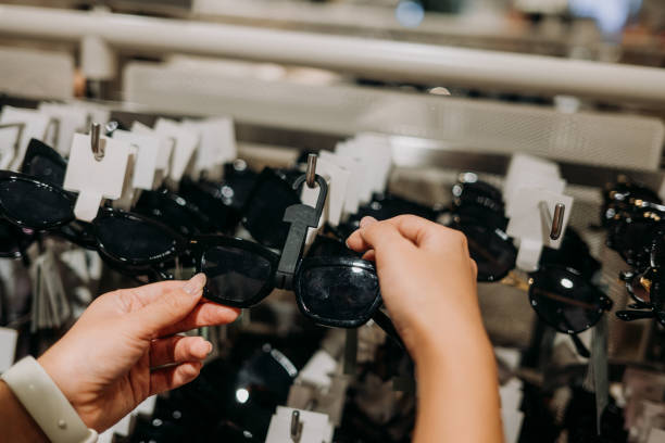 istock Choosing sunglasses in store 2163501602