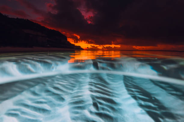istock Split view with sunset or sunrise and underwater sandy sea bottom. 2163502141