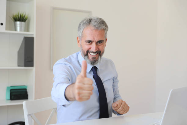 istock A Middle-Aged Businessman Giving a Thumbs Up 2163502241