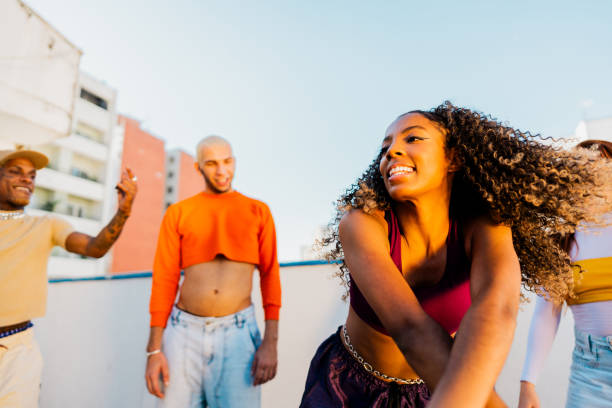 istock Young woman dancing at rooftop 2163502665
