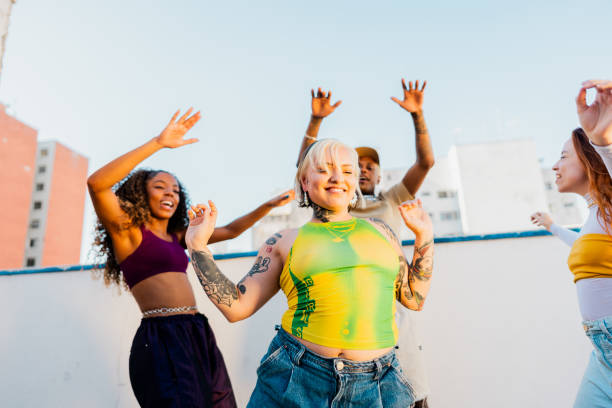 LGBTQIA+ Friends dancing at rooftop