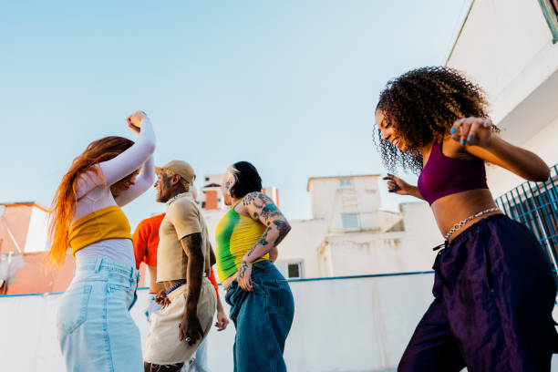 istock LGBTQIA+ Friends dancing at rooftop 2163502693