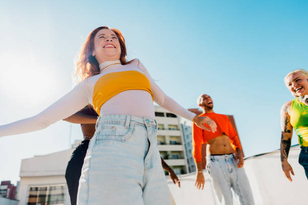 istock Young woman dancing at rooftop 2163502711