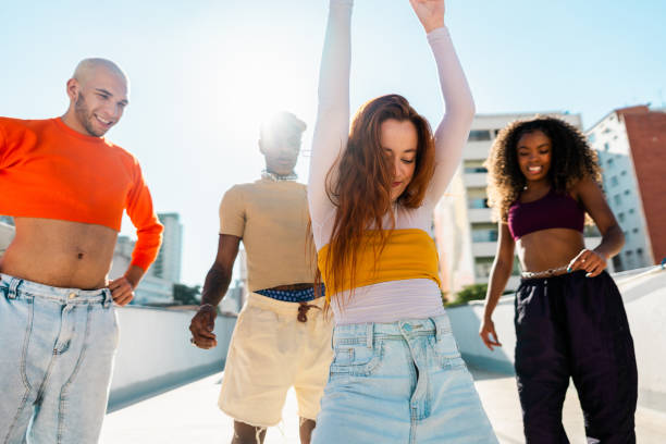 istock Young woman dancing at rooftop 2163502716