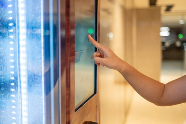 istock Smart Shopping: Asian Woman Uses Vending Machine for Quick Meal and Beverage 2163502748