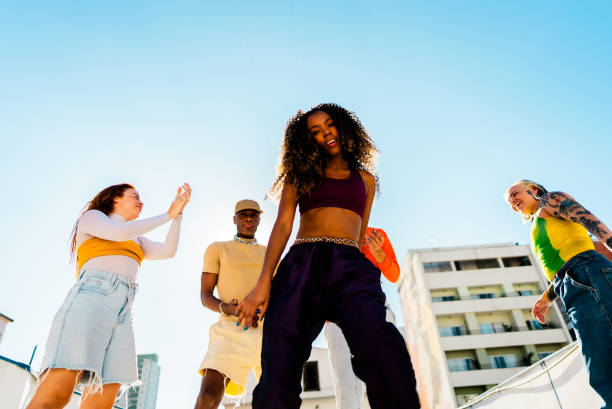 istock Young woman dancing at rooftop 2163503038
