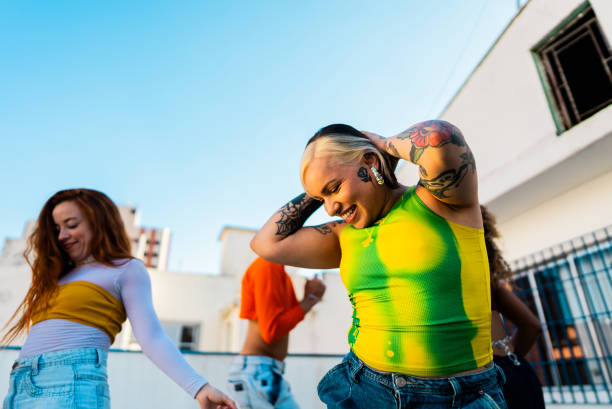 istock Young woman dancing at rooftop 2163503040