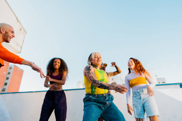 istock LGBTQIA+ friends dancing at rooftop 2163503162