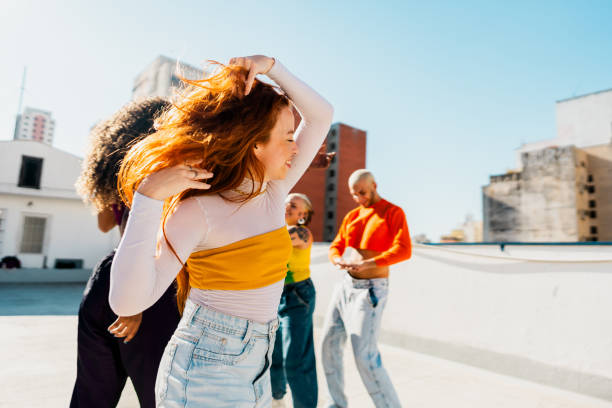istock Young woman dancing at rooftop 2163503719