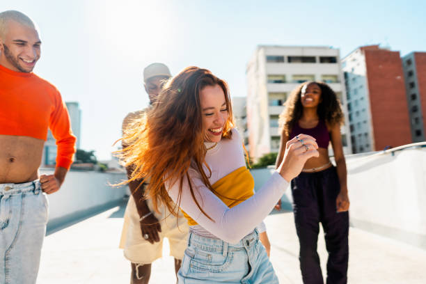 istock Young woman dancing at rooftop 2163503730
