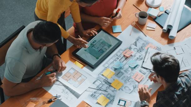 istock Top view of smart team working together to plan house construction. Symposium. 2163506370