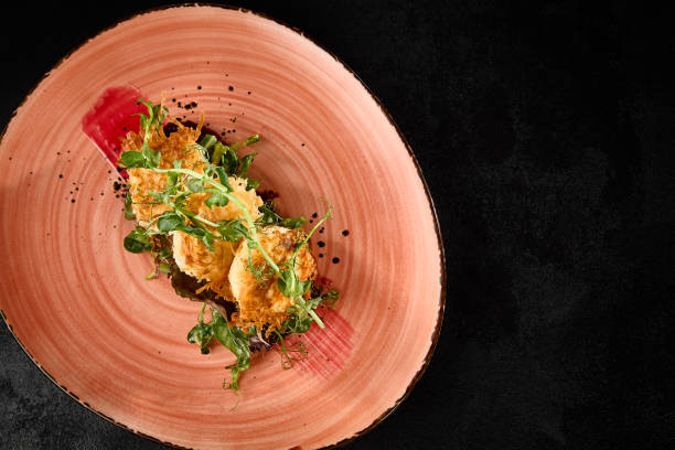istock Tempura Fried Cheese with Beetroot Garnish on a Decorative Plate 2163506413