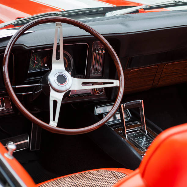 Shot on the blower injector on the mask of classic muscle car.
