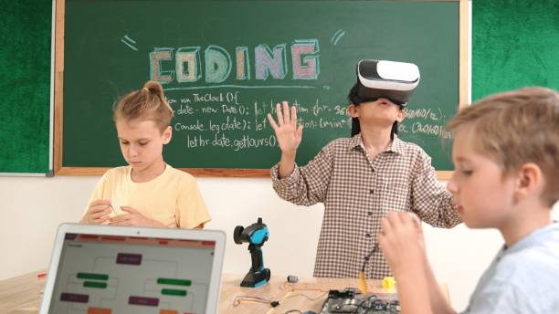 istock Asian child wearing Vr headset while enter virtual world at classroom. Pedagogy. 2163508687
