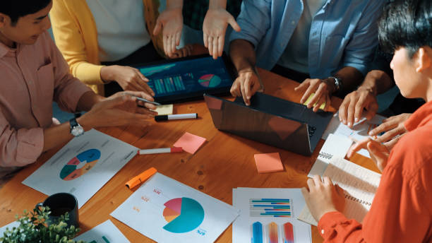 istock Top view of smart team discussing and analyzing financial chart. Convocation. 2163510617