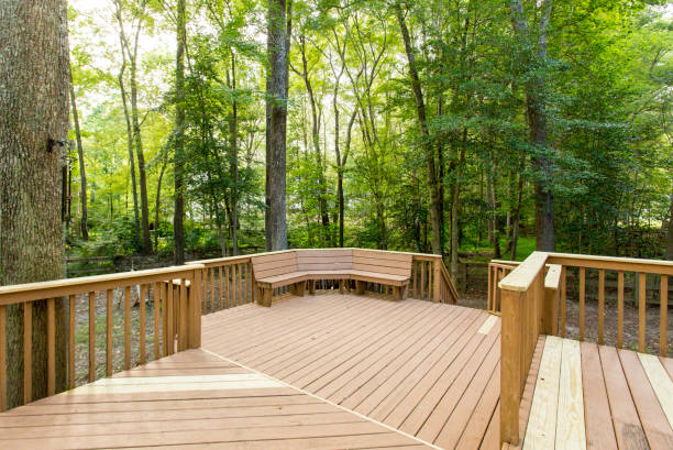 istock Spacious Wooden Deck In A Forested Area With Built-In Bench Seating. 2163514957